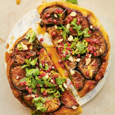 Sticky aubergine, pomegranate and herb tart