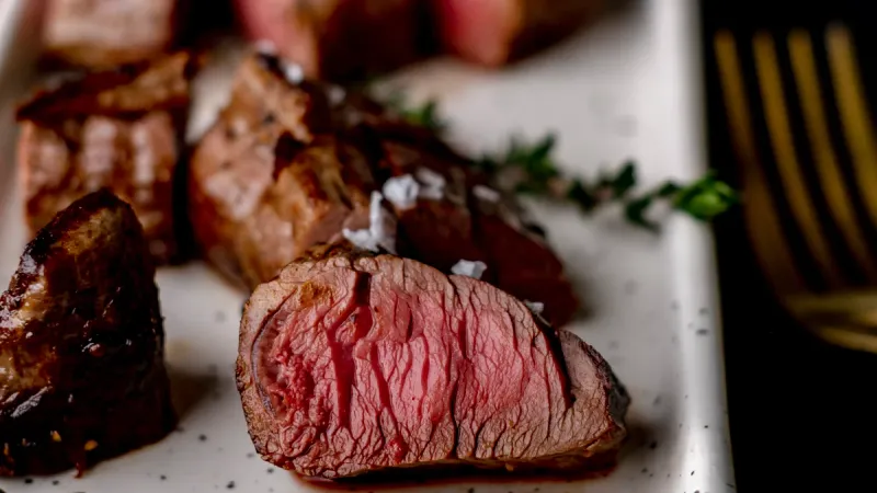 Marinated Venison Steaks, Roasted Beets, Celeriac Purée, Crispy Cavolo Nero and Blackberry Jus