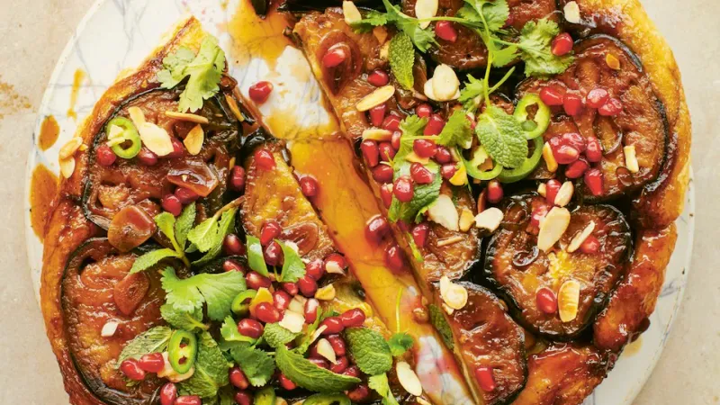 Sticky aubergine, pomegranate and herb tart